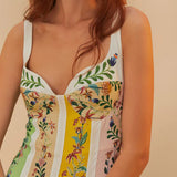 Woman wearing white maxi dress with colorful vertical floral stripes and sweetheart neckline — Farm Rio | Endless UAE