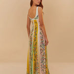 Back view of woman wearing a sleeveless maxi dress with colorful vertical floral stripes in yellow, pink and green — Farm Rio | Endless UAE