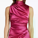 Woman wearing pink draped sleeveless maxi dress with high neckline and ruched detailing — Vasiliki | Endless UAE