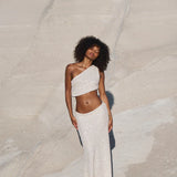 Woman wearing white sequin one-shoulder crop top and matching maxi skirt set against neutral background — Label Loft London | Endless UAE