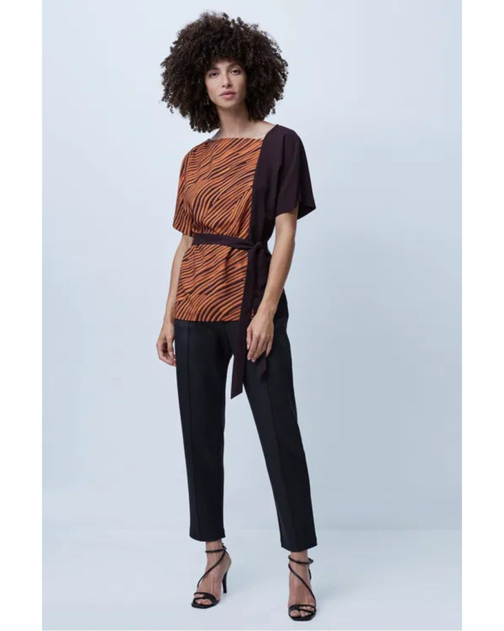 Woman wearing orange zebra stripe top with black sleeves and black cropped pants — French Connection | Endless UAE
