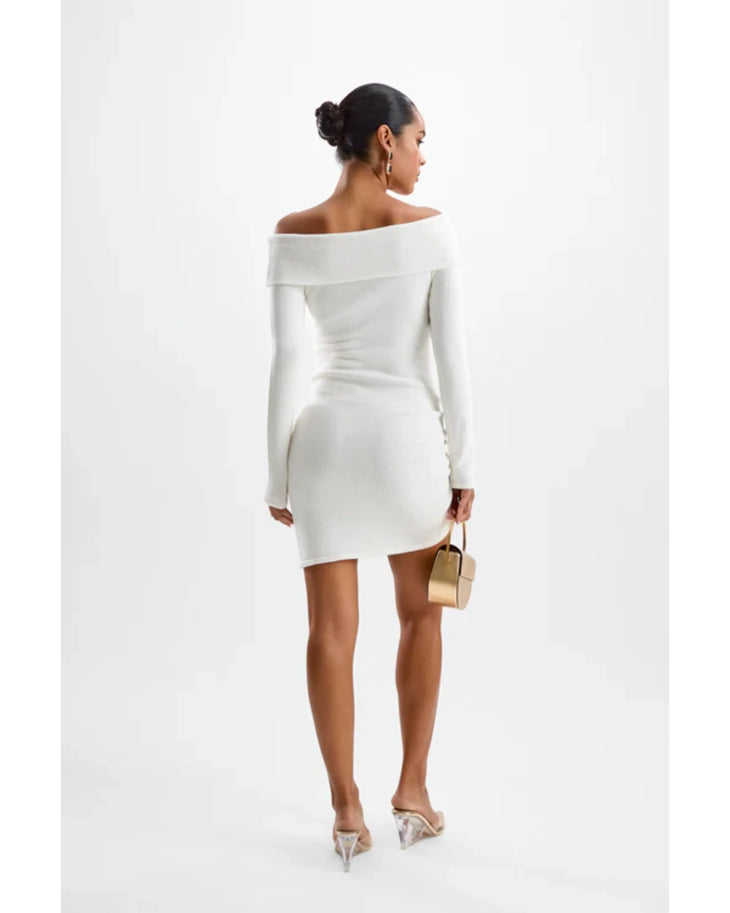 Woman in white off-shoulder long-sleeve knit dress with gold accents and matching accessories — Cin Cin | Endless UAE