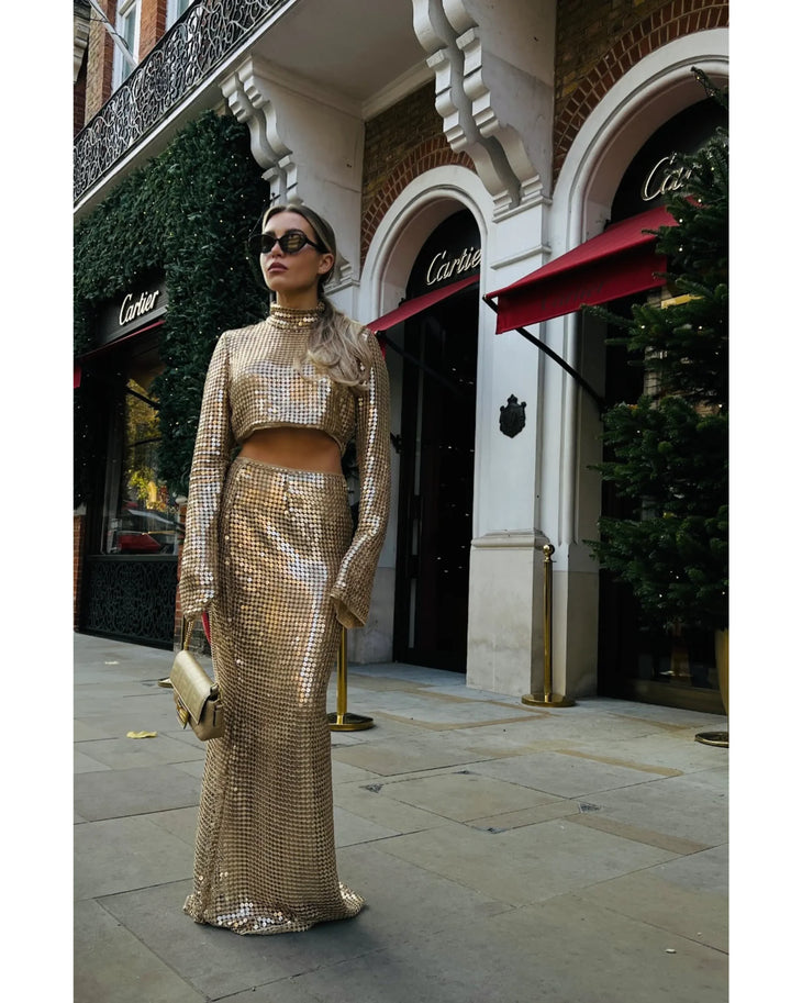 Gold sequined maxi skirt with high waist and cropped top, worn with matching crop top and accessories — Melissa Phair | Endless UAE