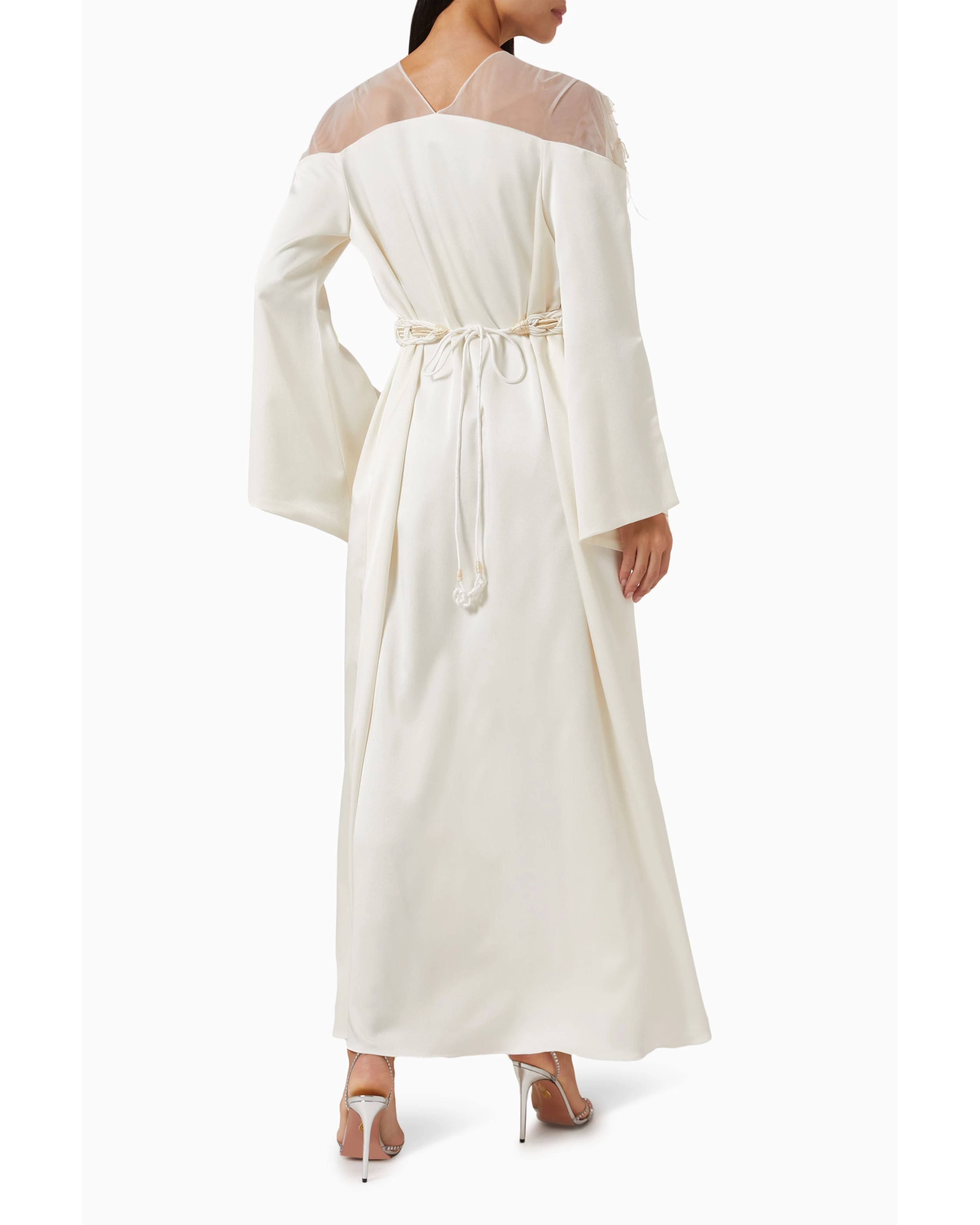 Ivory maxi dress with sheer mesh shoulders, bell sleeves, and braided rope belt tie at waist, shown from back — Nass | Endless UAE