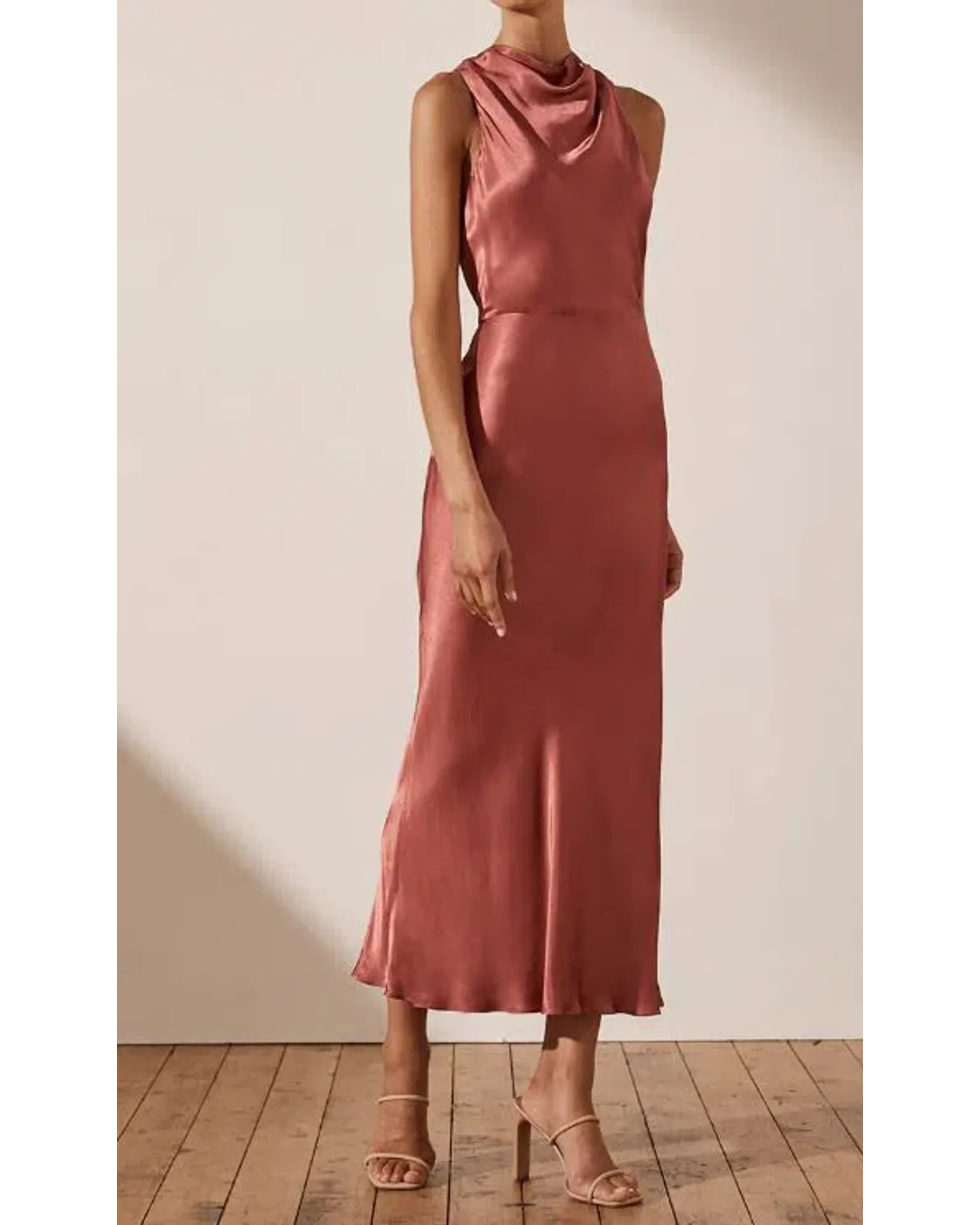 Woman wearing rust-colored high neck bias midi dress with strappy heels — Shona Joy | Endless UAE