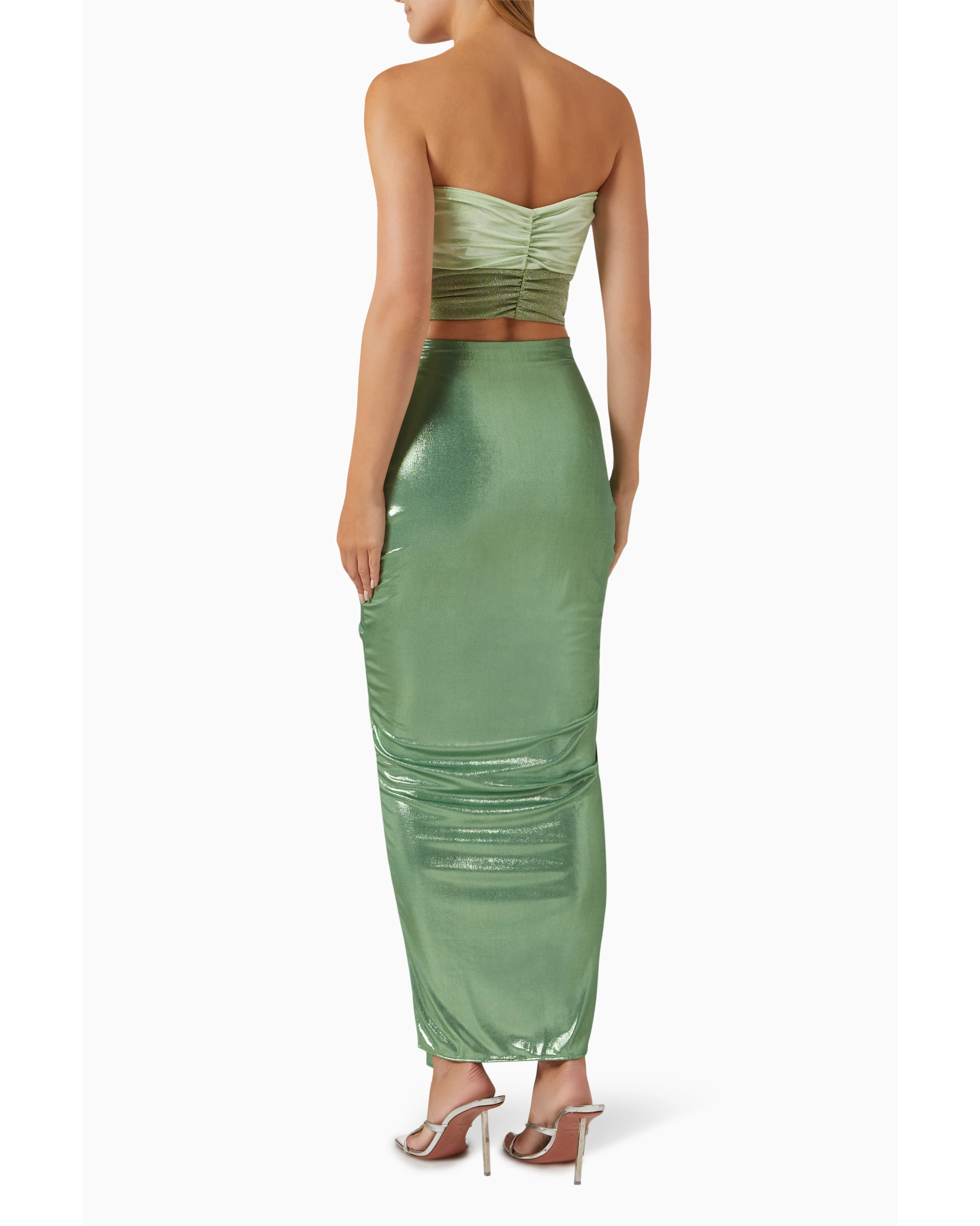 Woman wearing sage green ruched cutout maxi dress with metallic finish and strappy sandals — Baobab | Endless UAE