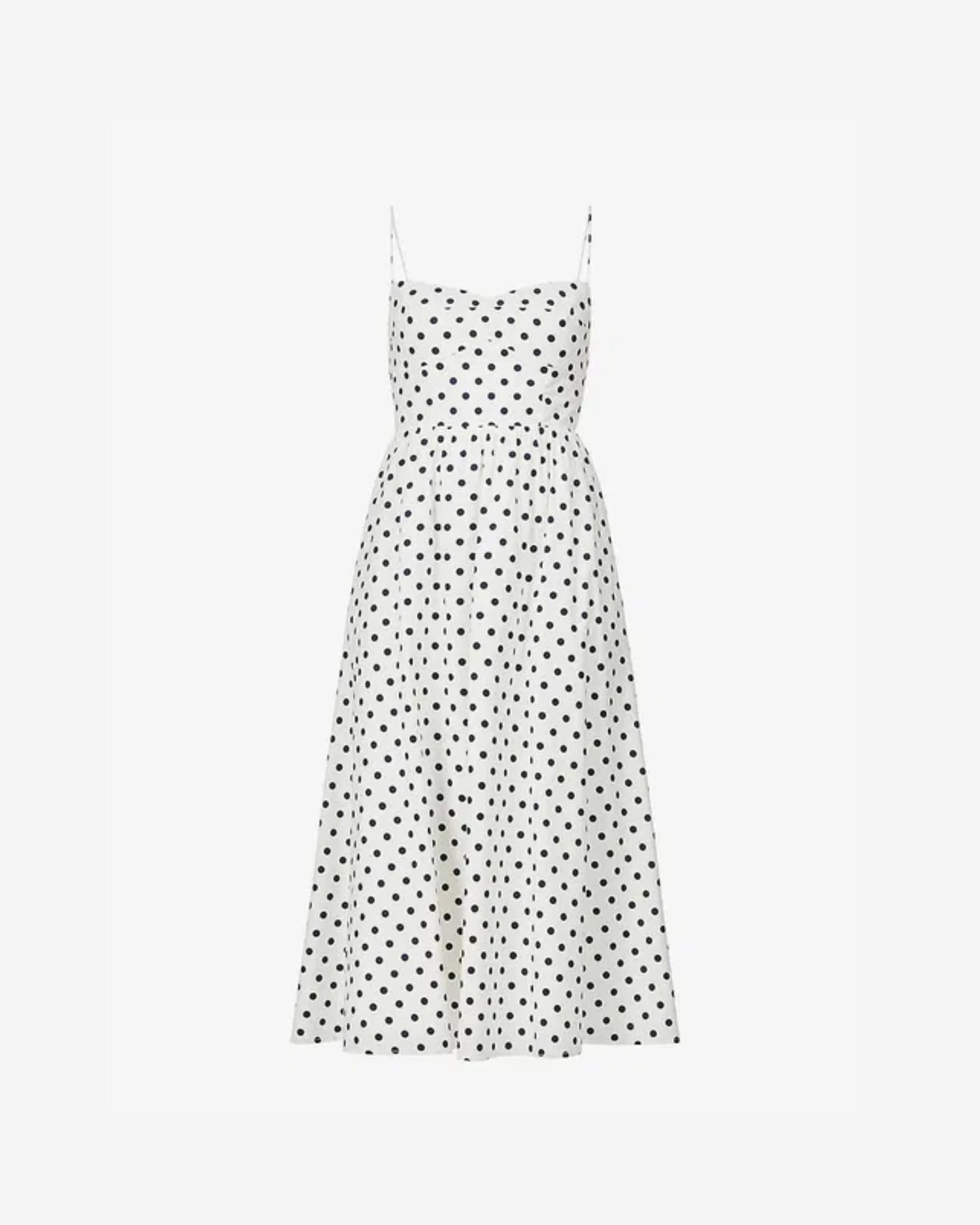 White midi dress with black polka dots, sweetheart neckline, and thin spaghetti straps — Reformation | Endless UAE