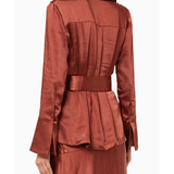 Rust-colored satin blazer with pleated back detail and matching belt, worn from behind — Significant Other | Endless UAE