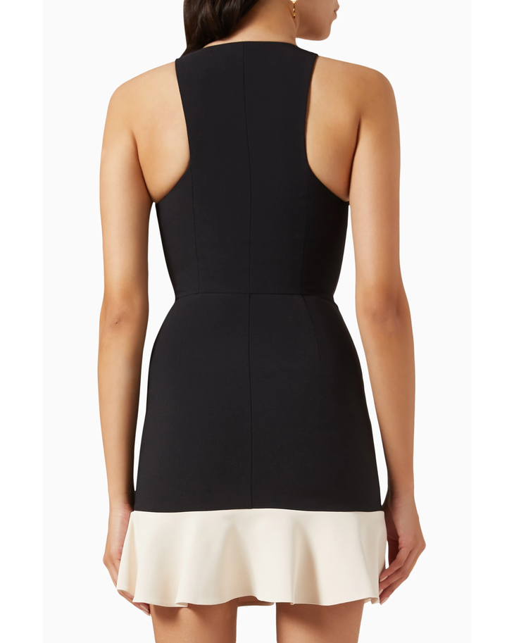 Woman wearing black and cream mini dress with gold turn-lock belt and chain shoulder bag — Elisabetta Franchi | Endless UAE