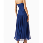 Woman wearing Isola Strapless Ruched Midi Dress in blue with black sandals — Shona Joy | Endless UAE
