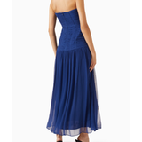 Woman wearing Isola Strapless Ruched Midi Dress in blue with black sandals — Shona Joy | Endless UAE