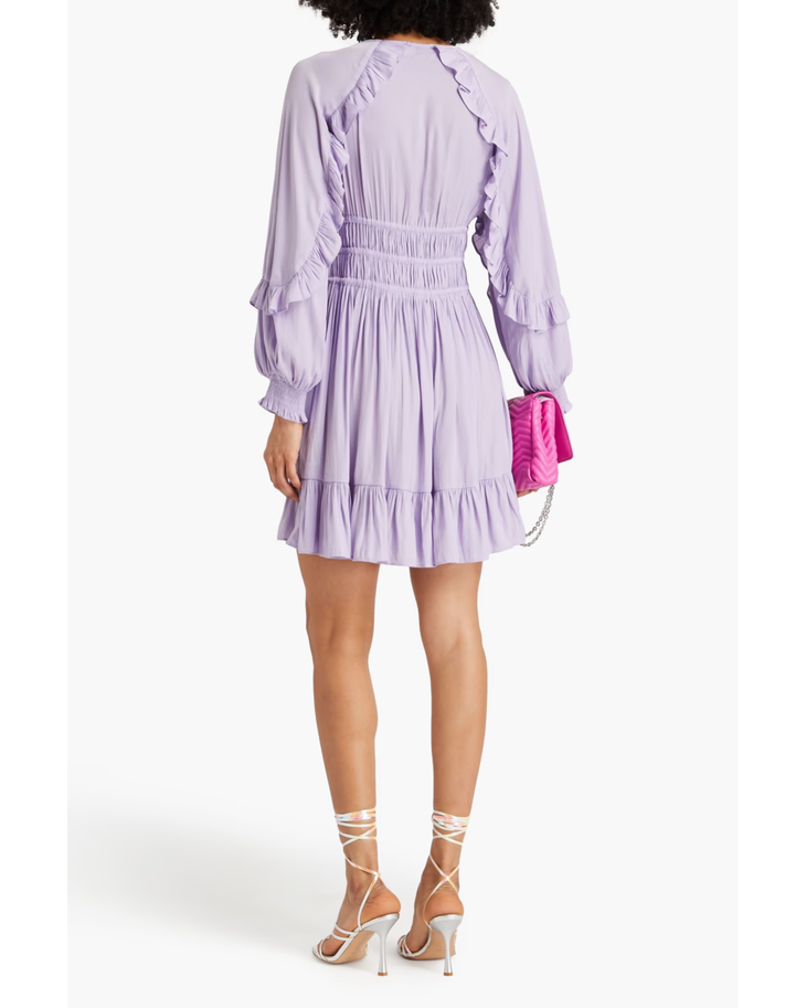 Lilac ruffle-trimmed mini dress with smocked waist and long sleeves, worn with white strappy heels — Endless | Endless UAE