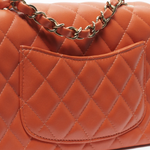 Coral quilted lambskin mini classic handbag with gold CC logo — Chanel | Endless UAE