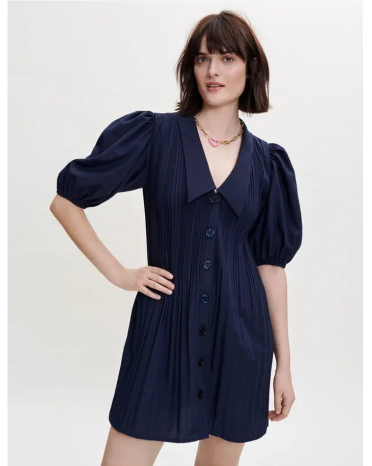 Navy pleated dress with collar and puff sleeves, styled with black knee-high boots — Maje | Endless UAE