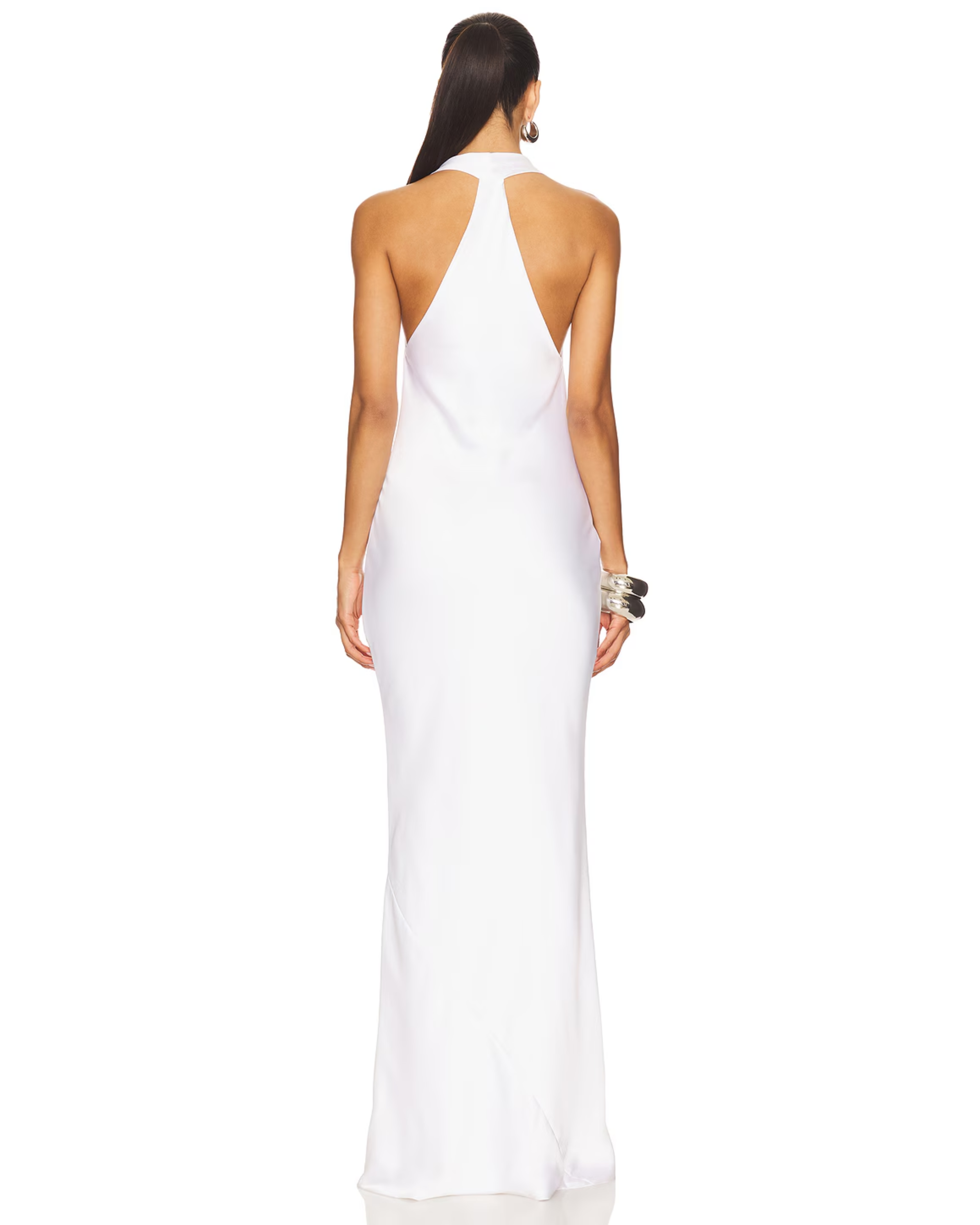 Woman wearing white halter drape bias gown with silver cuff bracelet — Norma Kamali | Endless UAE