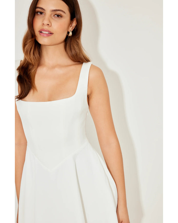 Woman wearing white sleeveless square neck mini dress with white heeled sandals — Odd Muse | Endless UAE