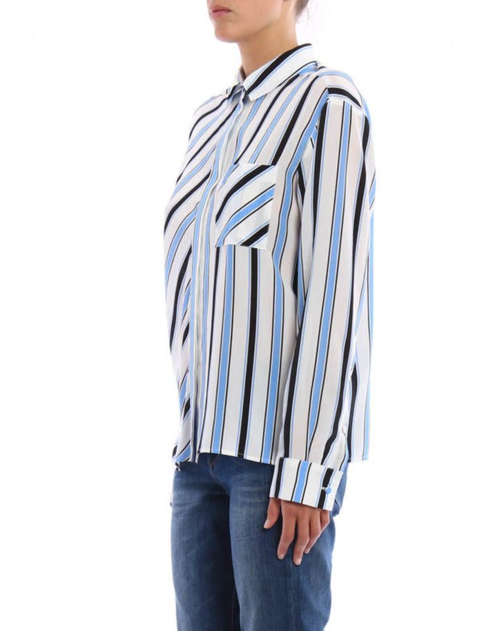 Striped silk shirt with blue, black and white diagonal stripes paired with dark blue jeans — M.S.G.M | Endless UAE