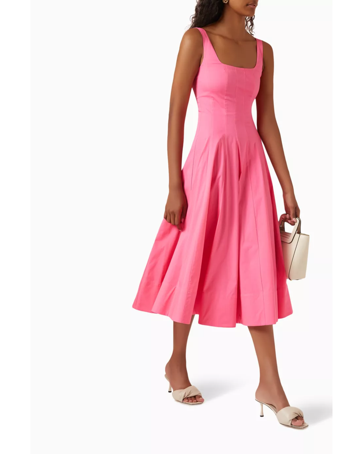 Pink sleeveless midi dress with fitted bodice and full pleated skirt, styled with beige accessories — Staud | Endless UAE