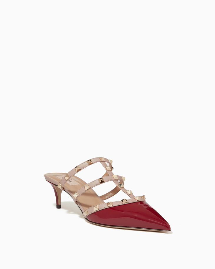 Rockstud Mules in red and beige leather with signature pyramid studs — Valentino Garavani | Endless UAE