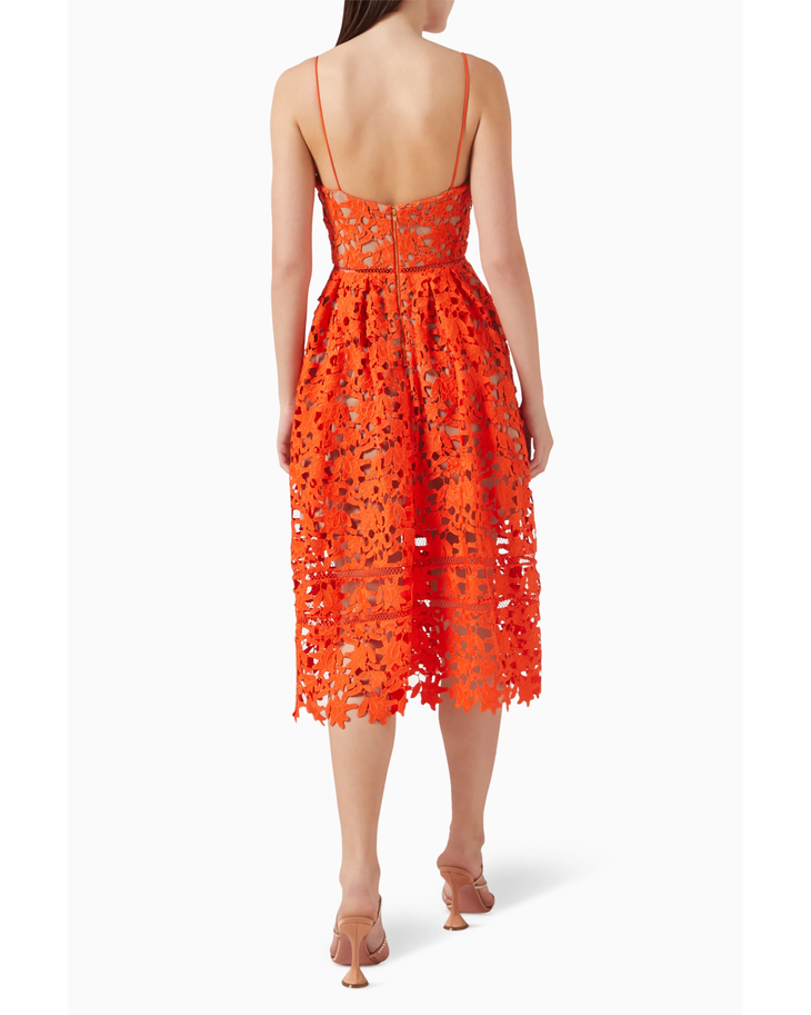 Woman wearing vibrant orange lace midi dress with thin straps and cutout details — Self-Portrait | Endless UAE