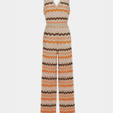 Woman wearing a colorful striped cotton jumpsuit with orange, brown and cream zigzag pattern — Missoni | Endless UAE