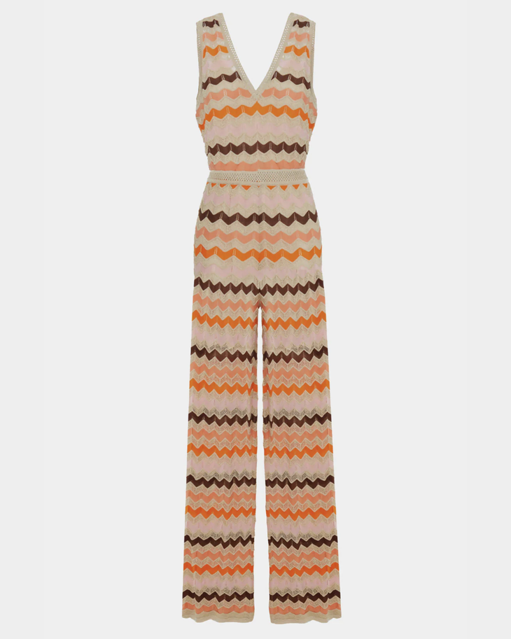 Woman wearing a colorful striped cotton jumpsuit with orange, brown and cream zigzag pattern — Missoni | Endless UAE
