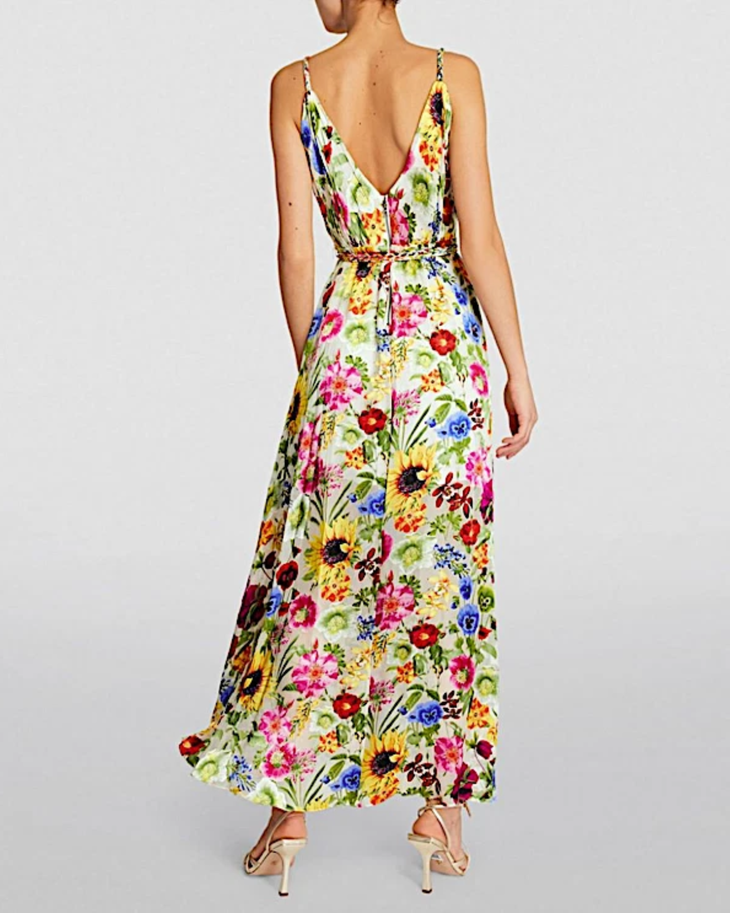 Woman wearing a colorful floral faux wrap maxi dress with sunflowers and pink flowers — Alice & Olivia | Endless UAE