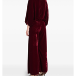 Woman wearing burgundy silk velvet jumpsuit with ornamental detailing and wide legs — Themis-Z | Endless UAE