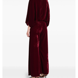 Woman wearing burgundy silk velvet jumpsuit with ornamental detailing and wide legs — Themis-Z | Endless UAE