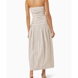 Woman wearing beige and white striped strapless midi dress with pleated skirt — Anna Quan | Endless UAE