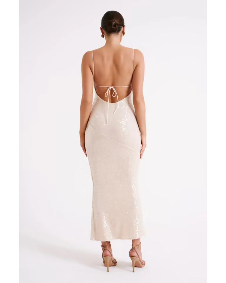 Woman wearing cream sequin maxi dress with thin straps and ankle length — Meshki | Endless UAE