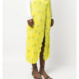 Yellow pleated floral midi skirt with asymmetric hem paired with white tank top and cardigan — Rokh | Endless UAE