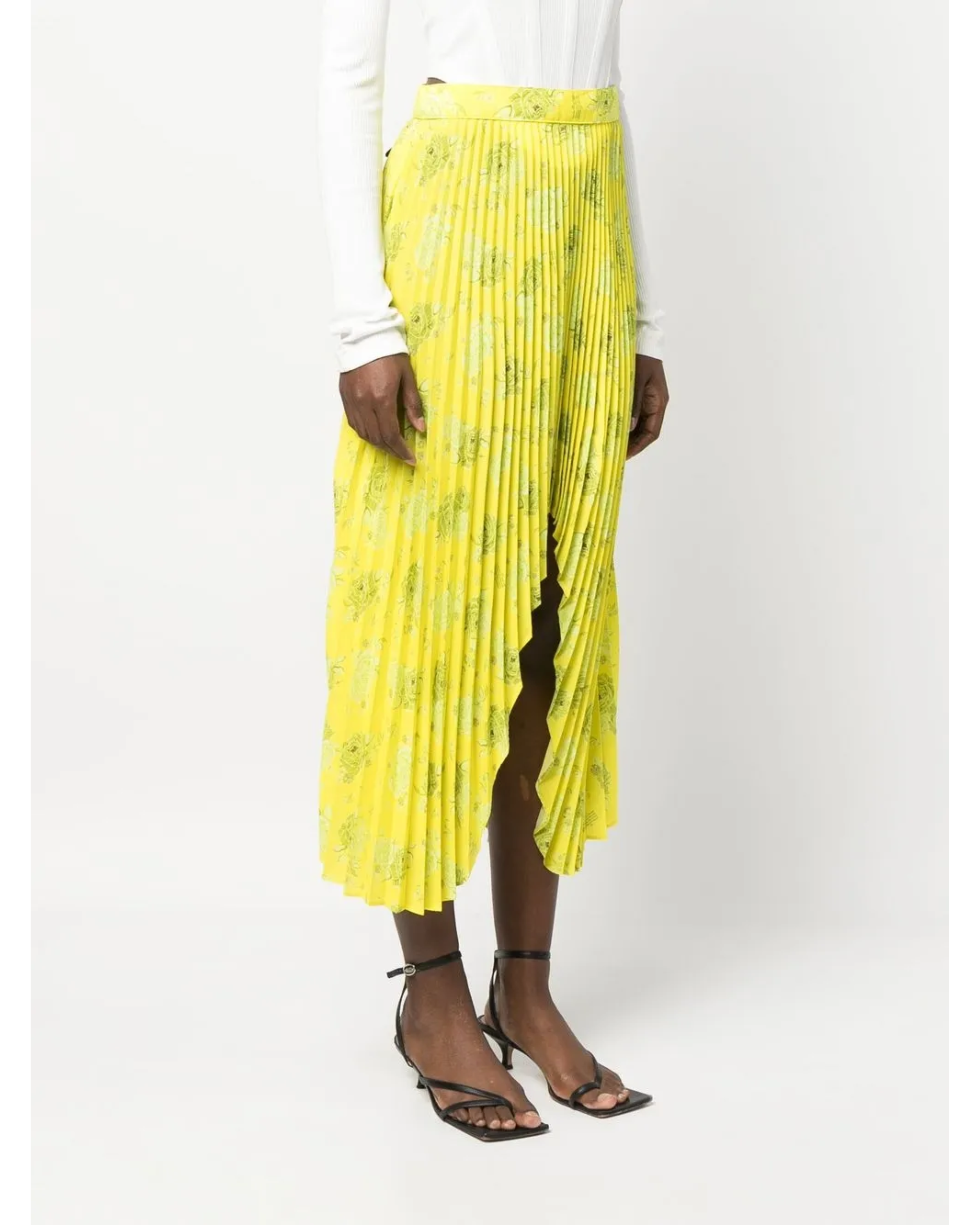 Yellow pleated floral midi skirt with asymmetric hem paired with white tank top and cardigan — Rokh | Endless UAE