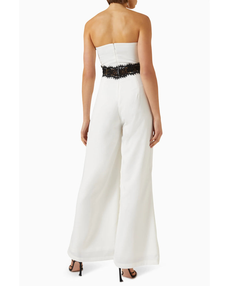 Woman wearing cream strapless jumpsuit with black lace waistband — Elle Zeitoune | Endless UAE