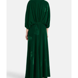 Woman wearing a forest green silk velvet maxi dress with draped sleeves and embroidered details — Themis-Z | Endless UAE