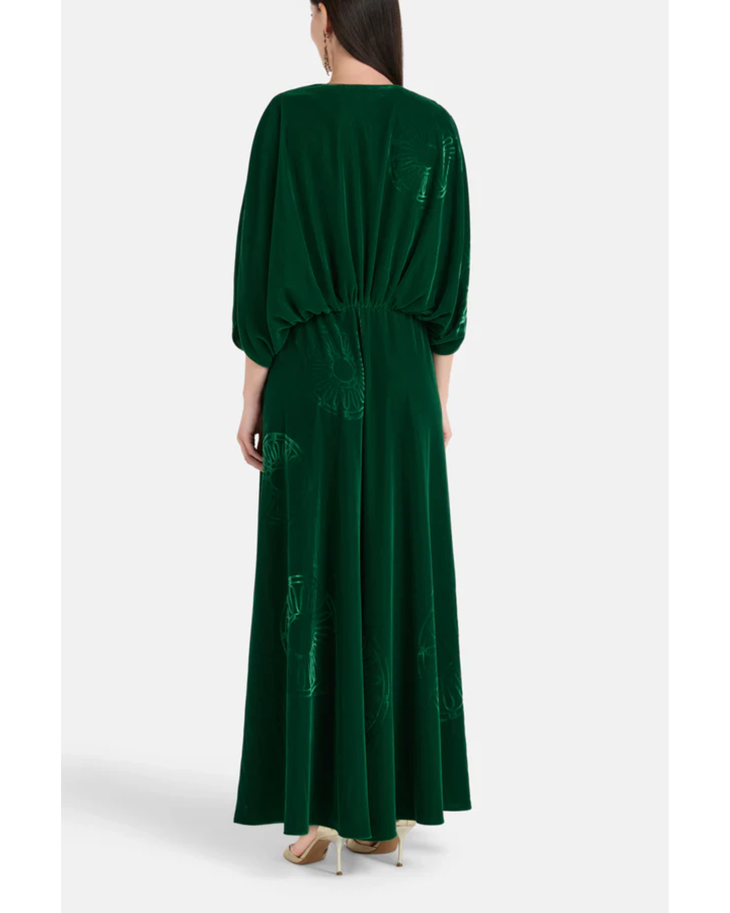 Woman wearing a forest green silk velvet maxi dress with draped sleeves and embroidered details — Themis-Z | Endless UAE