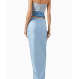 Woman wearing light blue Giselle Maxi Dress with cutout details and white handbag — Baobab | Endless UAE