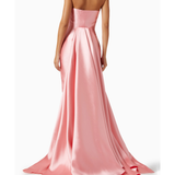 Elegant pink strapless gown with flowing train and pleated skirt, shown from back view — Solace London | Endless UAE