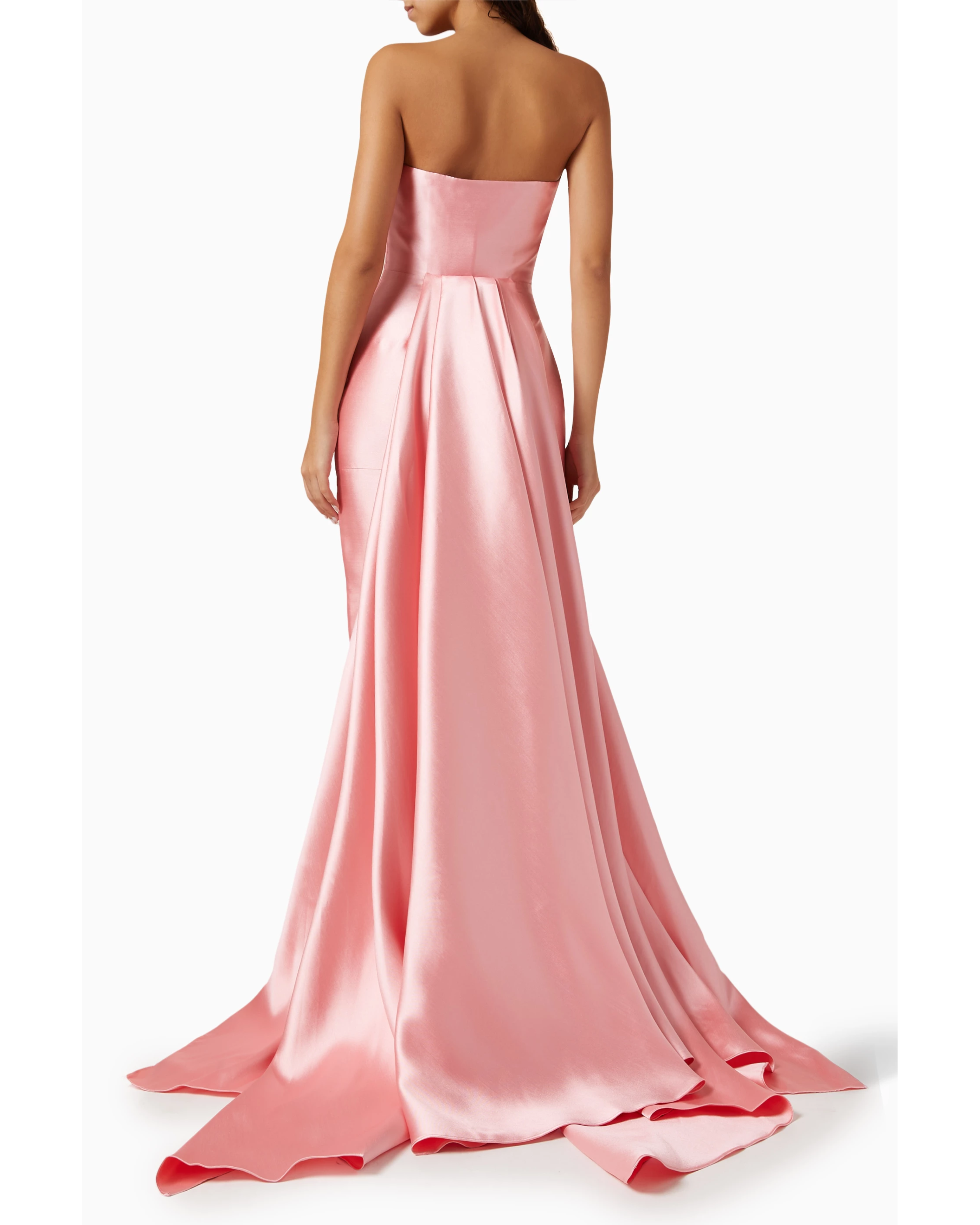 Elegant pink strapless gown with flowing train and pleated skirt, shown from back view — Solace London | Endless UAE