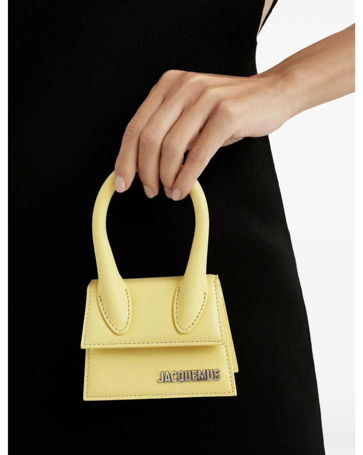 Pale yellow mini handbag with curved top handle and contrasting stitching detail — Jacquemus | Endless UAE