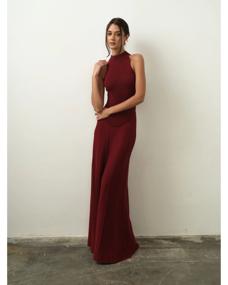 Elegant burgundy ribbed halter neck maxi dress with flowing wide-leg pants in rich wine color — Nora The Label | Endless UAE