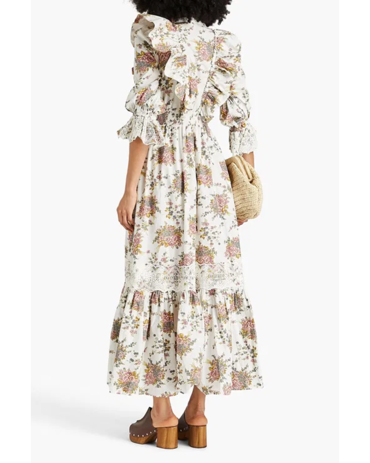 Woman wearing a cream floral ruffled cotton maxi dress with puff sleeves — Bytimo | Endless UAE