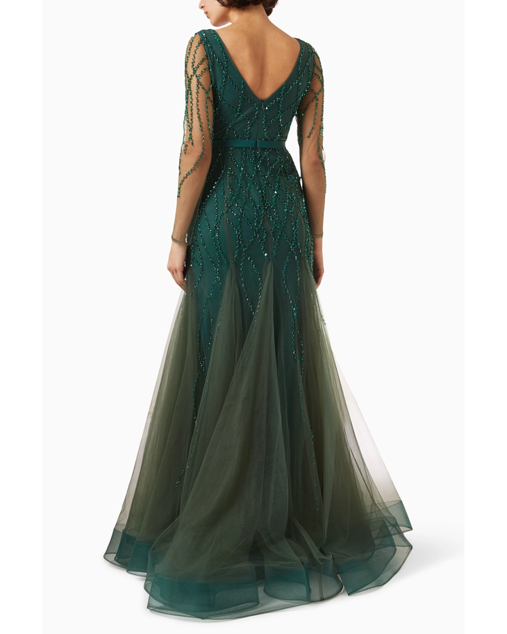Elegant emerald green floor-length tulle gown with intricate sequin beadwork, sheer long sleeves, and V-back detail — Basix | Endless UAE
