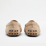 Beige suede junior driving loafer with black rubber sole and stitched detailing — Tod's | Endless UAE