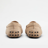 Beige suede junior driving loafer with black rubber sole and stitched detailing — Tod's | Endless UAE