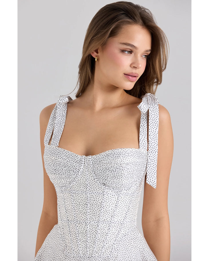 Woman wearing white chiffon mini dress with dot print and tie-shoulder straps — House Of CB | Endless UAE