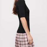 Black knit top with pink plaid wool skirt dress — Maje | Endless UAE