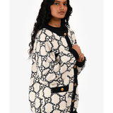 Gucci monogram logo bomber jacket in beige and black with gold button details and ribbed trim — Gucci | Endless UAE