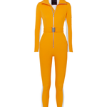 Bright yellow ski suit with belted waist and black turtleneck, paired with black skis — Cordova | Endless UAE