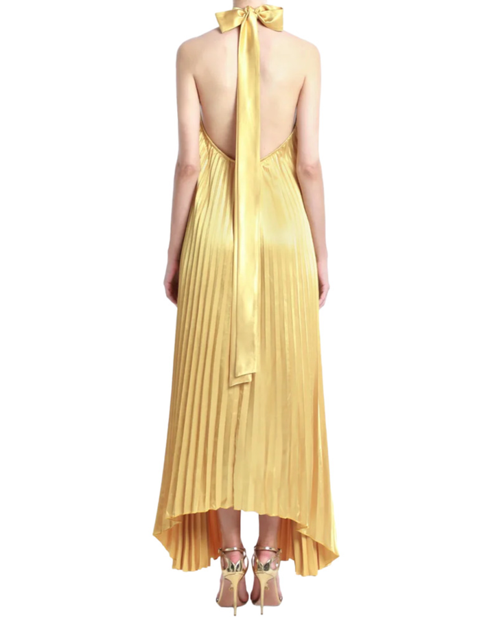 Woman wearing pleated marigold halter gown with high-low hemline — L'IDÉE | Endless UAE